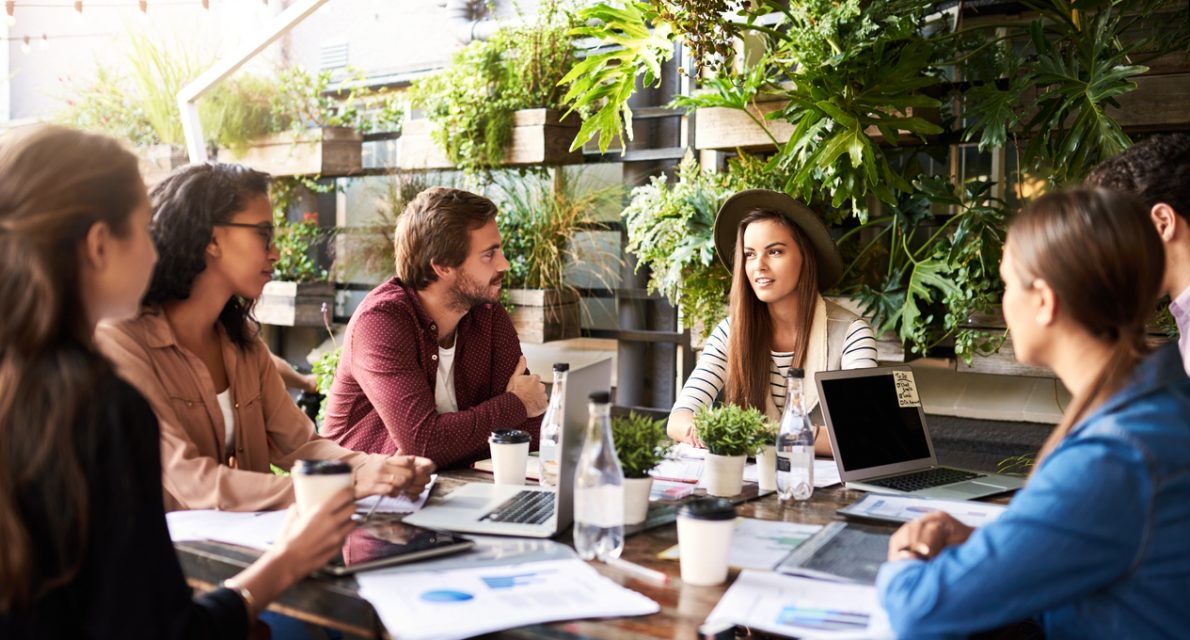 Shot of a group of designers having a meeting at a coffee shop